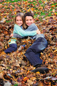 Kids hugging in leaves