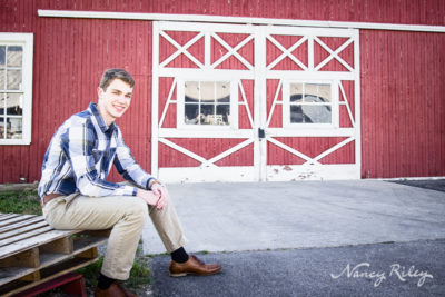 Senior boy with barn