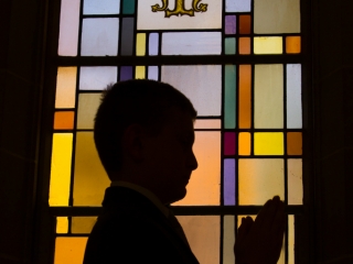 First Communion portrait with stained glass window