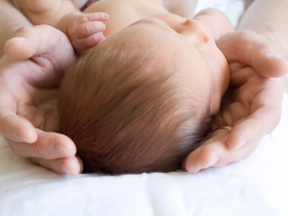 Newborn in father's hands