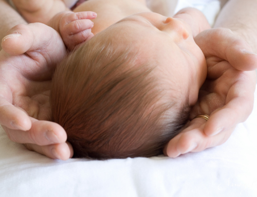 Newborn in father’s hands