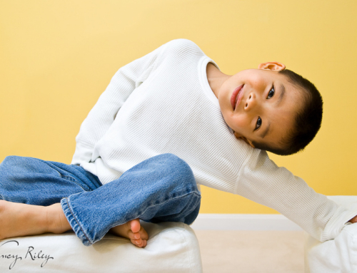 Boy portrait against yellow wall