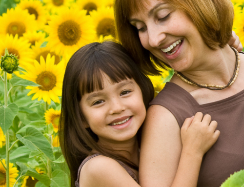 Mother and daughter in sunflower field