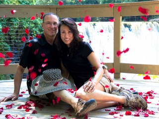 Engagement couple in rose petals