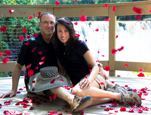 Engagement couple in rose petals