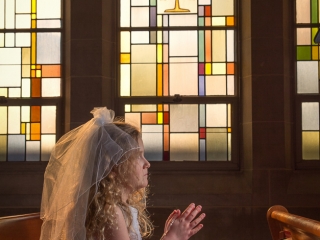 First Communion portrait with stained glass