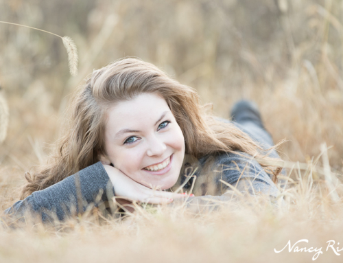 Senior lying in grass