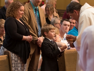 First Communion Andrew with parents