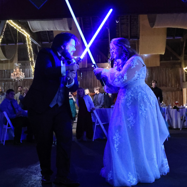 Wedding light saber duel