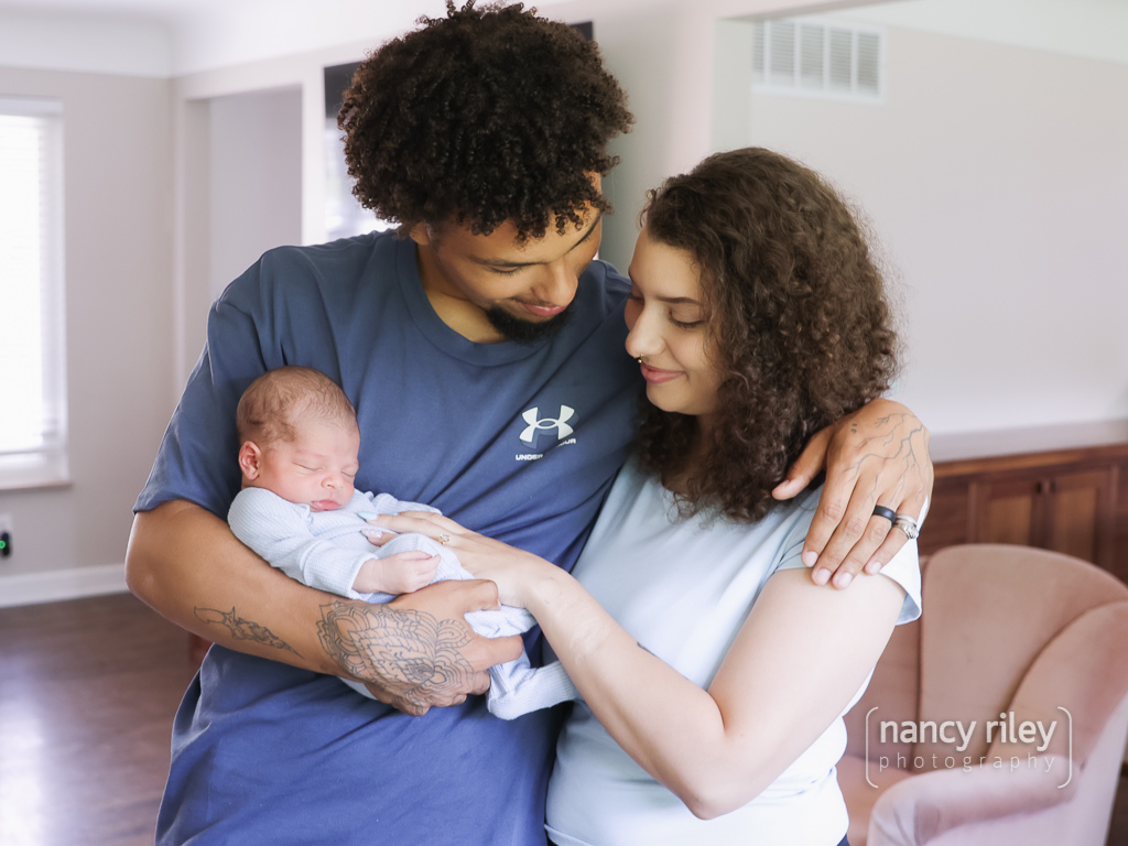 Parents holding newborn Parents holding newborn