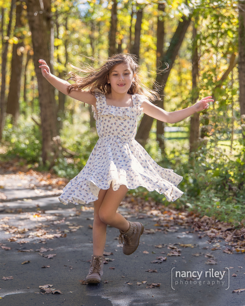 Girl twirling skirt in woods Girl twirling skirt in woods
